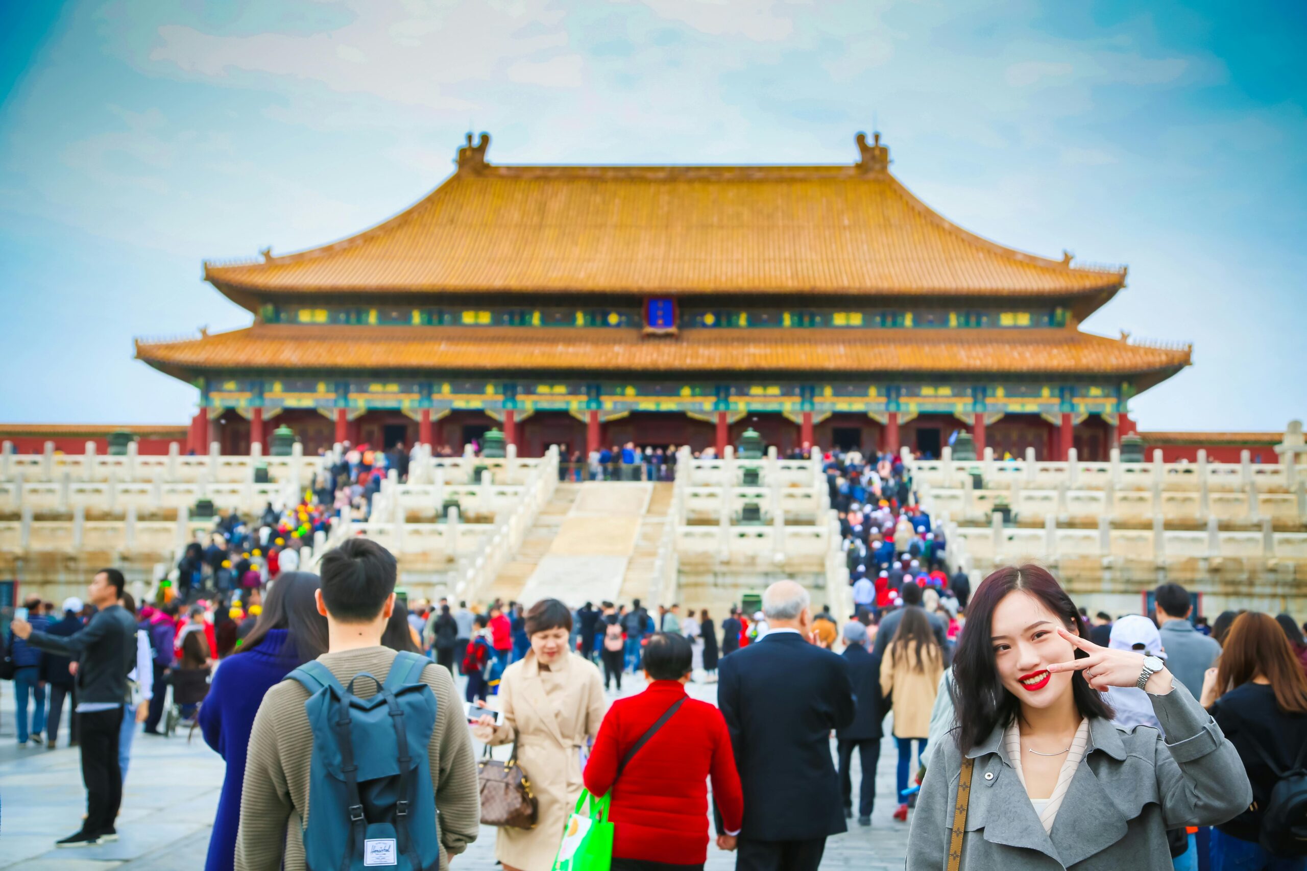 Tourists exploring the iconic Forbidden City in Beijing, a UNESCO World Heritage Site.